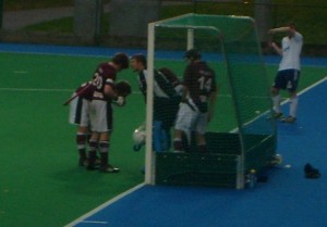 McGregor discusses with his team mates how the short corner defence will be organised.